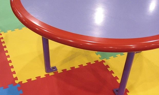 Children's Gathering table with bright colored floor mats