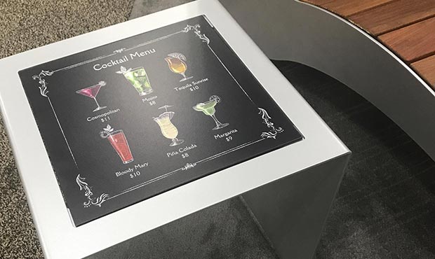 Custom drink menu on an interchangeable table surface