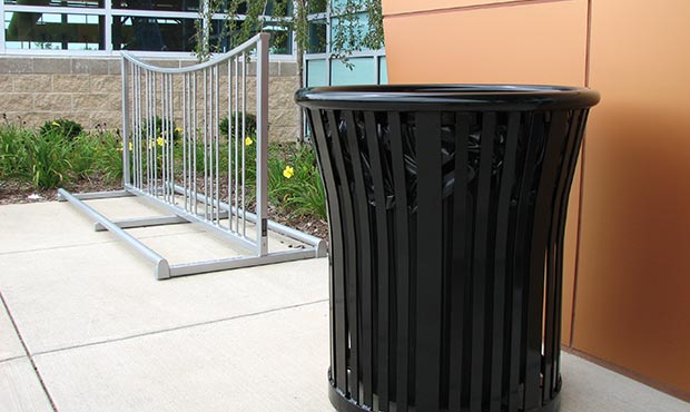 Steel litter receptacle and bike rack outside a health center