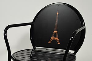 Eiffel Tower artwork on the back of an Olivia Chair