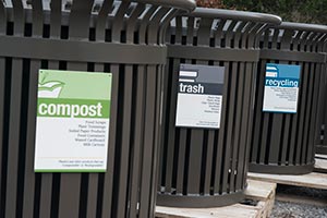 Midtown receptacles with trash, recycling, and compost sorting signage