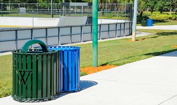 Penn dual litter and recycling receptacle on a basketball court