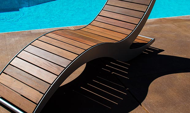 Loma Chaise Lounge in a resort pool setting