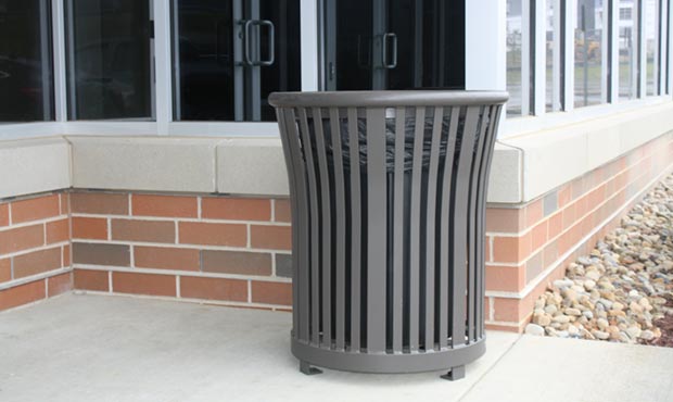 Harmony Litter Receptacle set against brick background