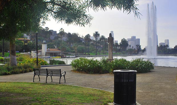 Schenley Bench and Reading Litter Receptacle with park fountain