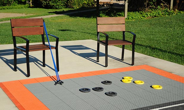 Everett Chairs at a shuffleboard court