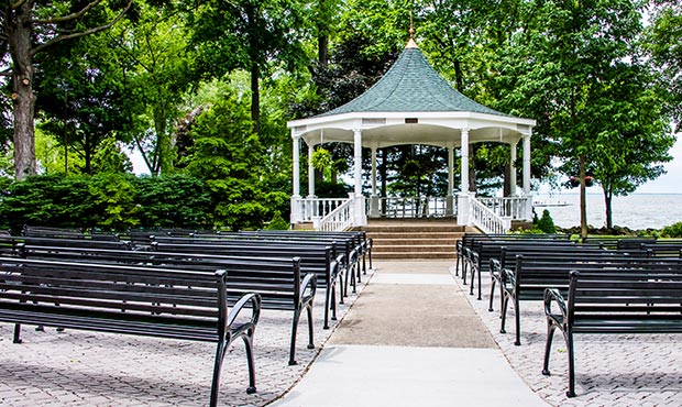 Schenley Benches installed near an outdoor lakeside performance space