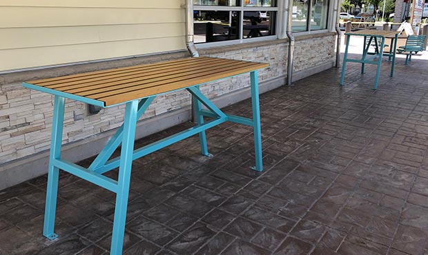 Standing height tables outside a restaurant in Miami, FL