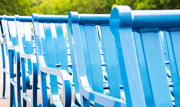 A row of freshly powder coated steel Pullman benches