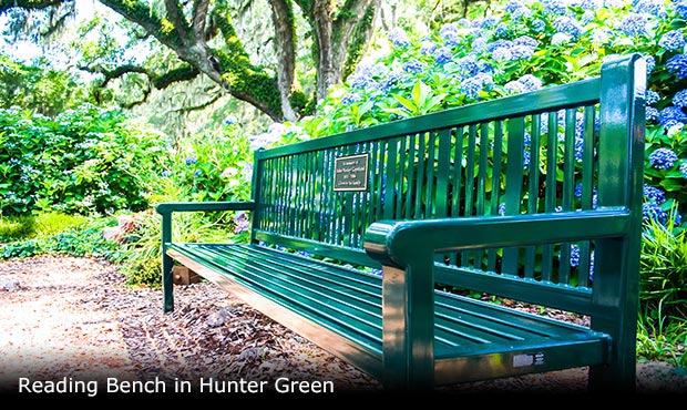 A commemorative memorial bench in a garden setting