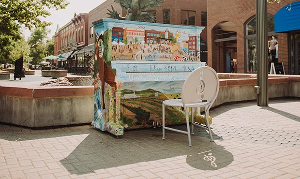 An artifully decorated piano and Olivia laser cut Chair are ready for use