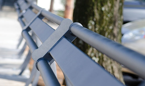 Penn Leaning Rails stand in a line at a city transit stop