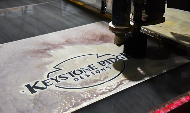 Keystone Ridge Designs Logo Being Cut With Laser