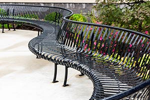 Curved Pullman Benches with Back that outline a guitar shape