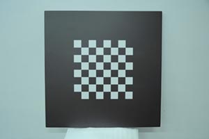 Checkerboard pattern on a square table top