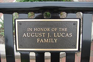 Memorial plaque closeup on bench back