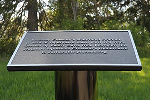 Commemorative plaque on a post