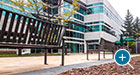 Exeter Benches with Back on a corporate campus patio