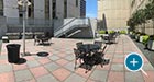 Courtyard Table and Chair Sets in a gathering space outside a corporate campus