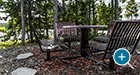 Hapsburg Table and Chair Set in a pine tree grove at Yellowstone National Park