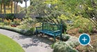 Memorial Reading Bench with Back and cast bronze plaque at Brookgreen Gardens, SC