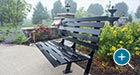 Carson Bench with Back in a residential garden setting