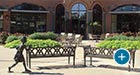 Augustine Benches with Back outside a restaurant