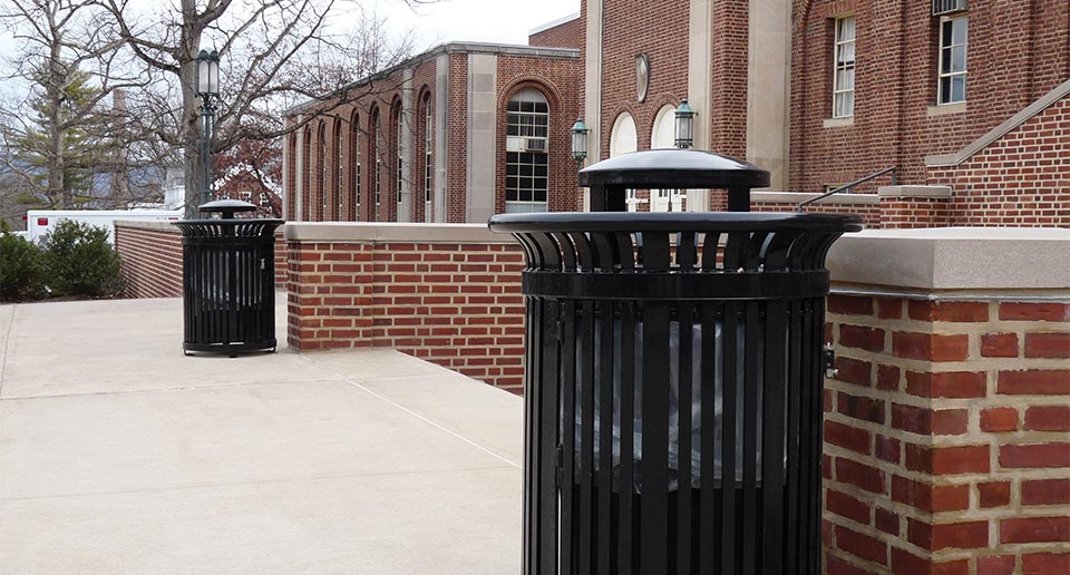 Midtown Litter Receptacles outside the entrance to a school gymnasium