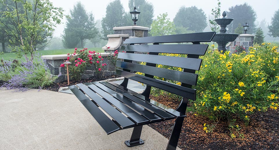 Carson Bench with Back in an outdoor residential garden patio