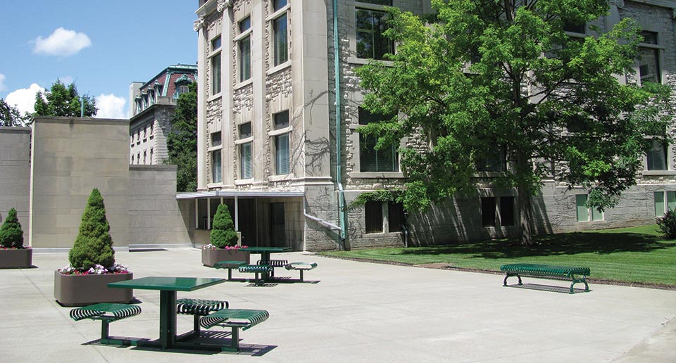 Hapsburg Table Sets and Flat Lamplighter Bench outside of a county administration building