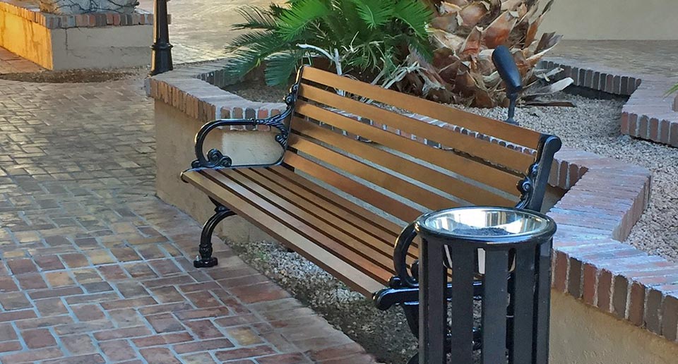 Rosedale Bench with Back and Reading Ash Urn in a small shopping complex